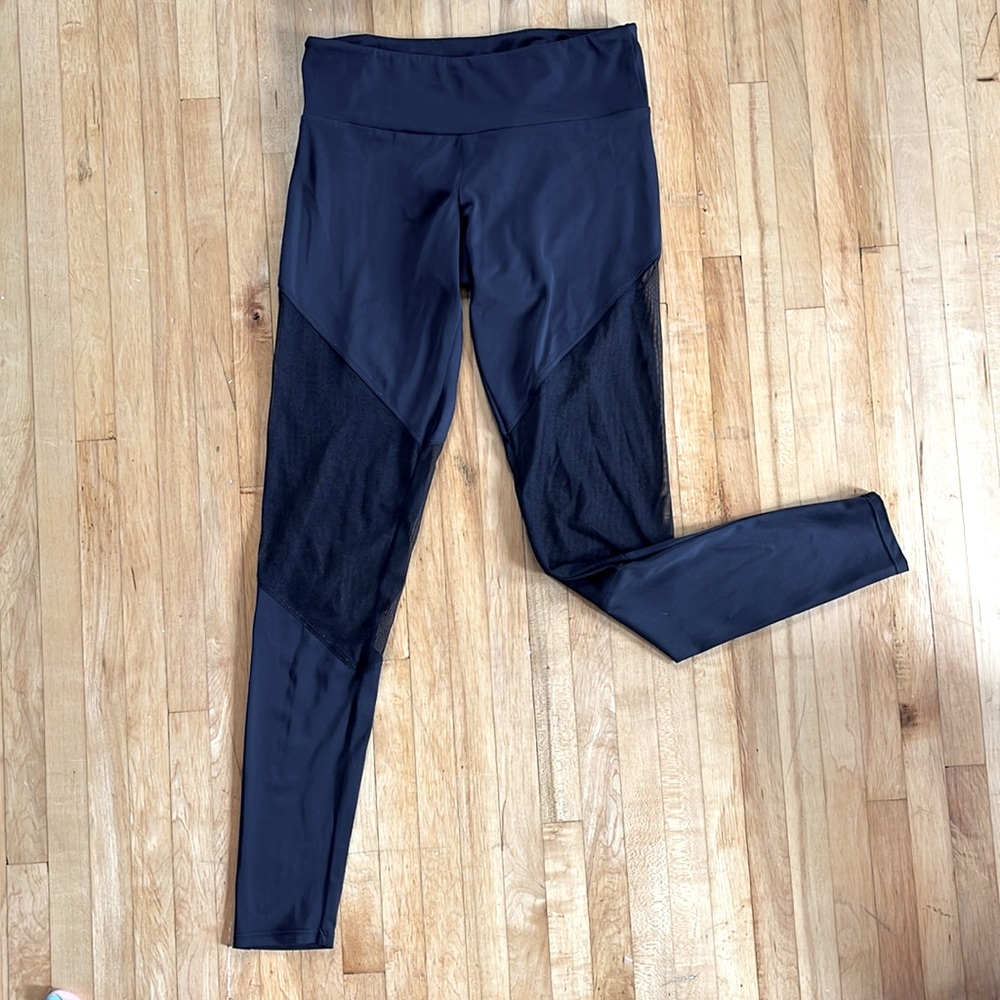 Onzie black leggings with mesh detail. Size S/M